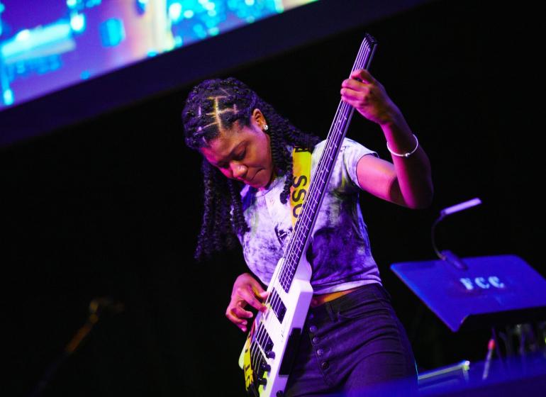 Photo of student playing bass